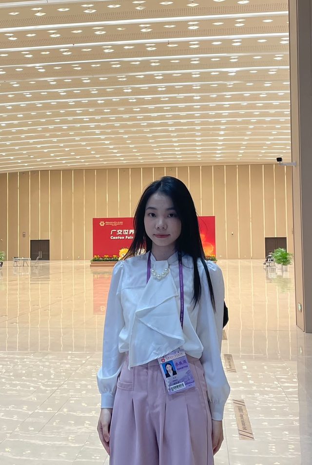Shirley Chou wearing an exhibitor pass in the main hall of the Canton Fair complex in Guangzhou