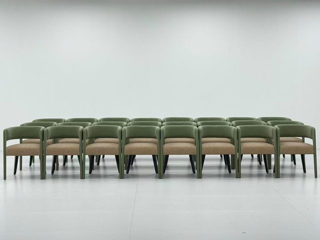 Rows of green and beige waiting-room chairs photographed during quality inspection