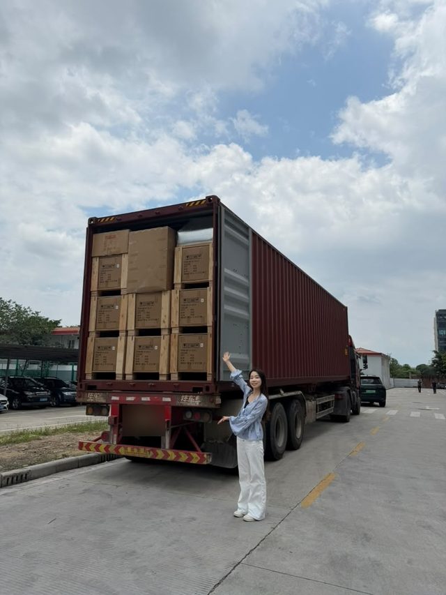 Shirley Chou beside the clinic order during container loading